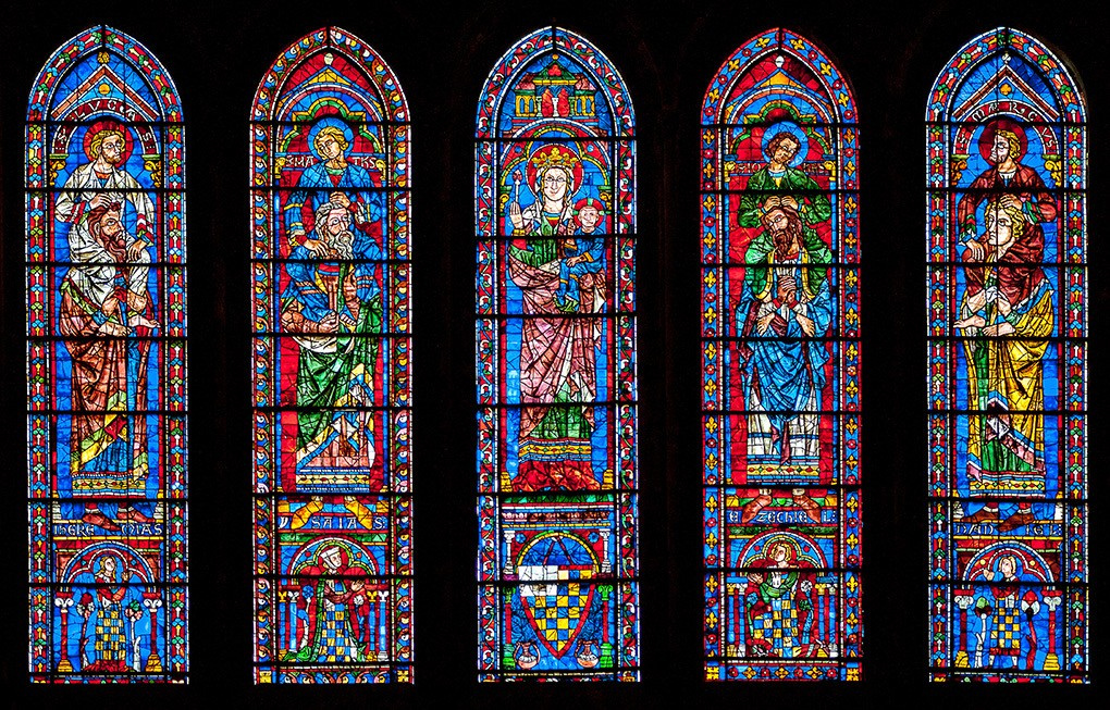 Stained glass in lancet windows under the southern rose window of Chartres Cathedral. Photo Source —