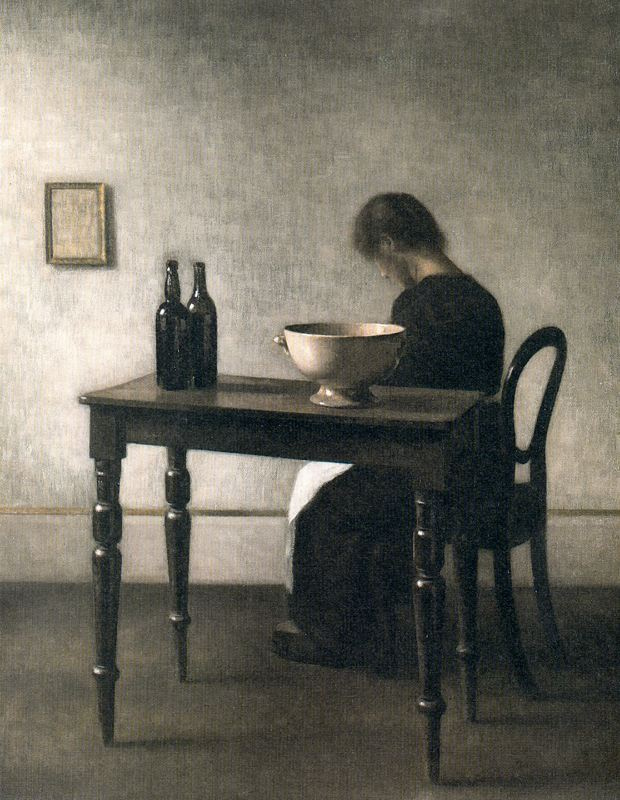 Vilhelm Hammershøi. Interior with a woman sitting at the table and a ceramic bowl