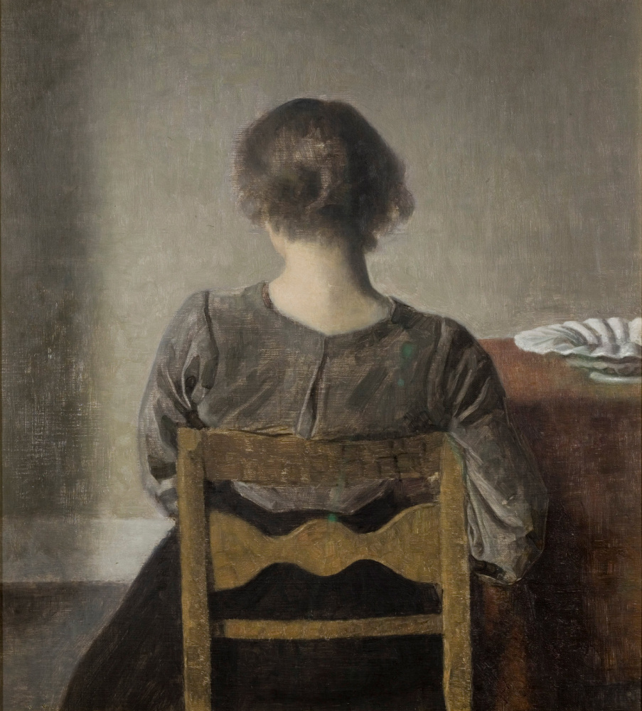 Vilhelm Hammershøi. Recreation. Young woman sitting with her back