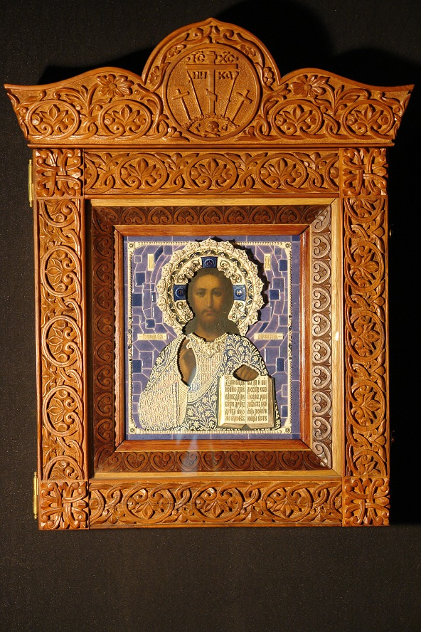 Moscow Icon Painting Workshop. Icon of Christ Pantocrator in a porcelain frame and carved icon case