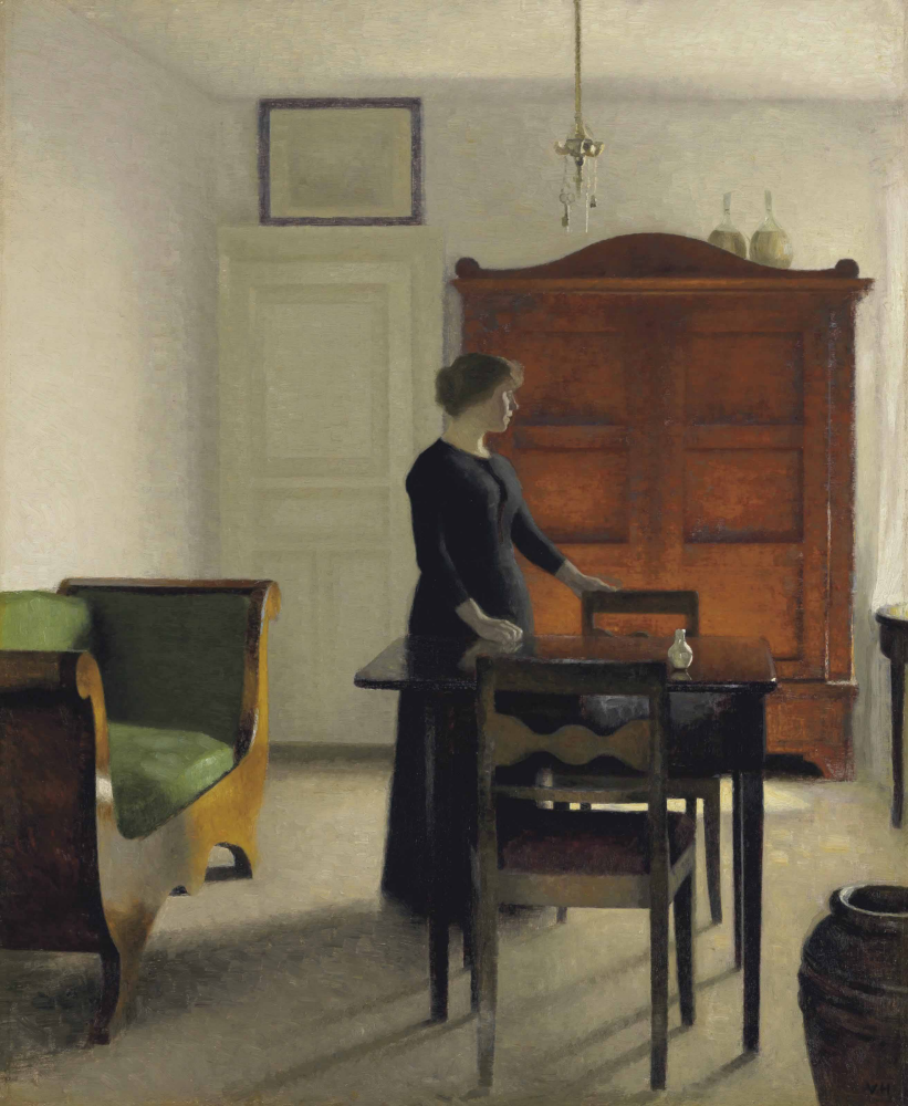 Vilhelm Hammershøi. Interior. Ida at the table in the living room