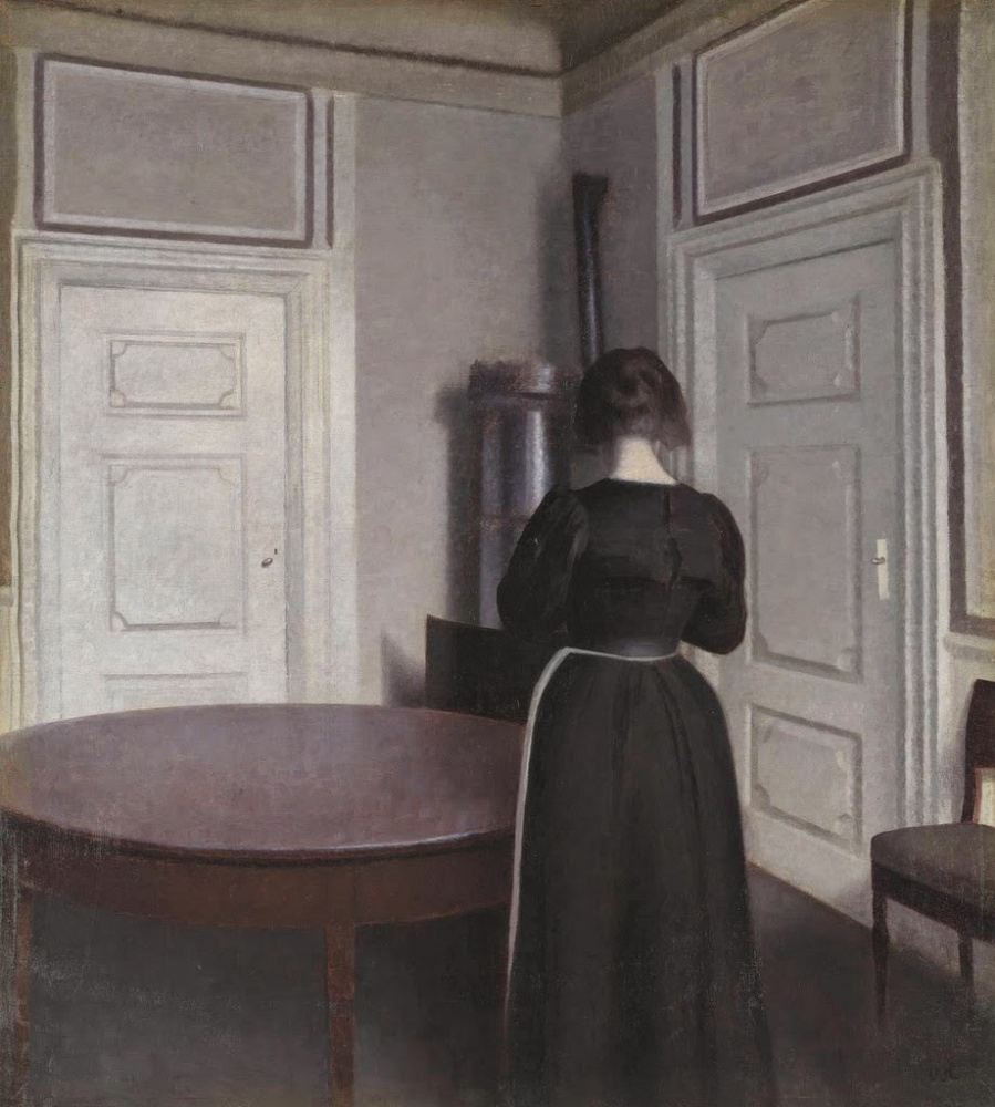 Vilhelm Hammershøi. Interior with a woman at the table