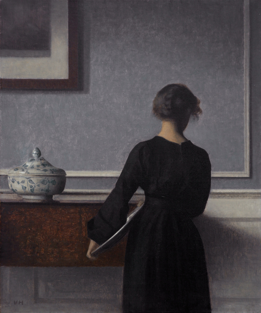 Vilhelm Hammershøi. Interior with a young woman standing back