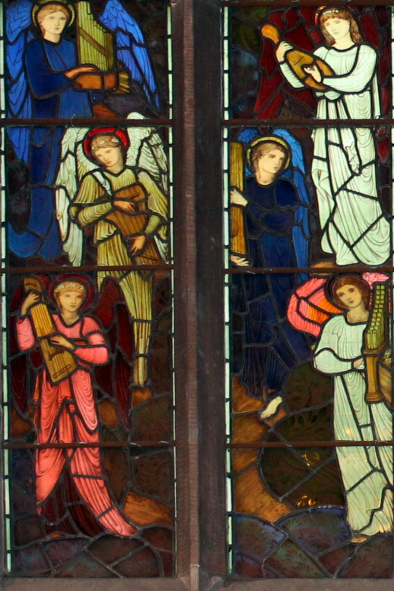 William Morris. The window of the altar of All Saints with the archangels Michael and Gabriel