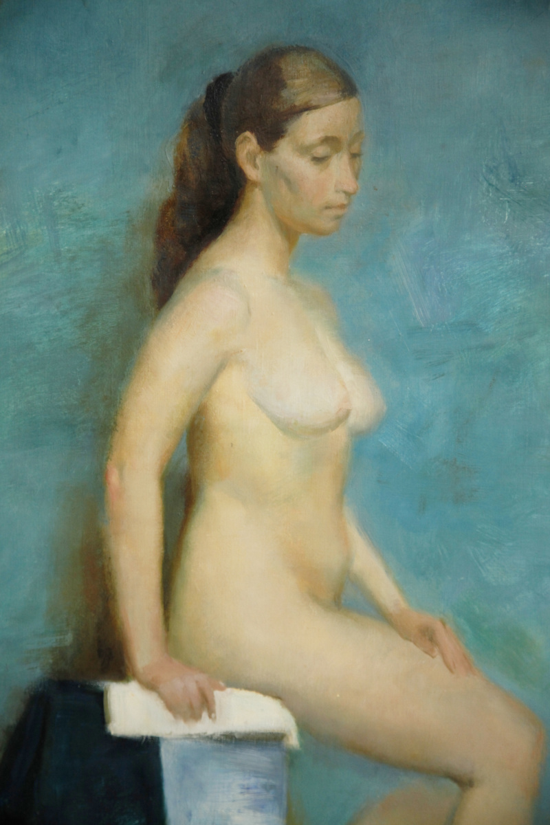 Seated Nude on blue background.