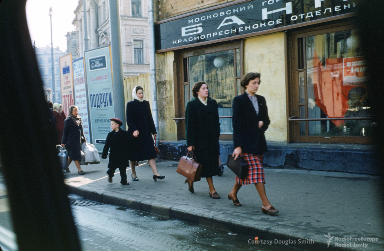 Historical photos. Theater posters on the street and May Day poster in a bank window in Moscow