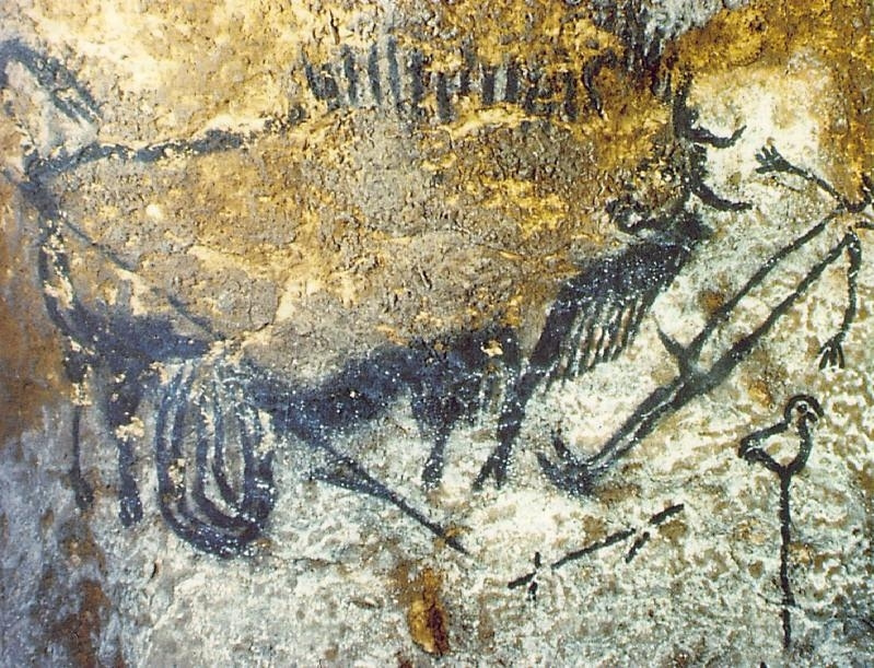 Painting Cave. The wounded Buffalo attacks man