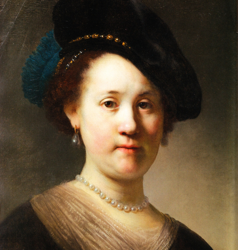 Portrait of young woman with pearls in a beret