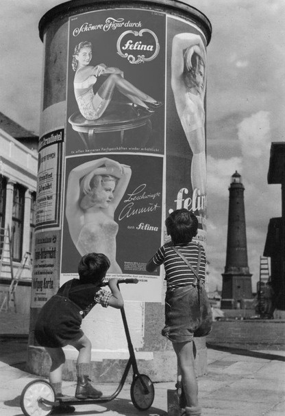 Historical photos. Children view lingerie ads