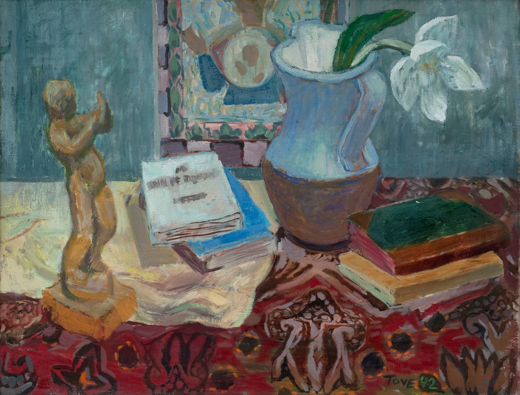 Tove Jansson. Still life with a figurine and books on a motley tablecloth